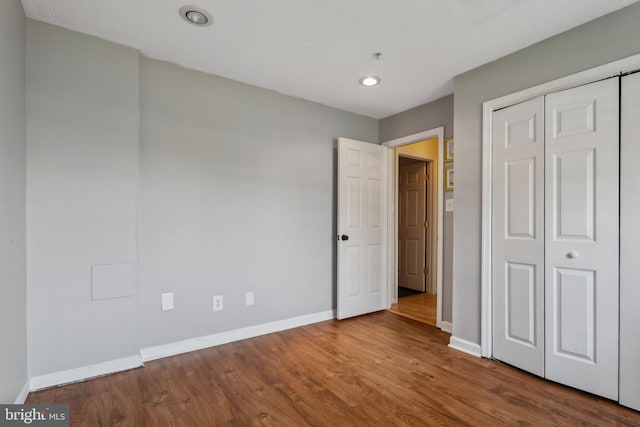 7140 Ladd Cir, Frederick, MD 21703 - unfurnished bedroom featuring baseboards, wood finished floors, a closet, and recessed lighting