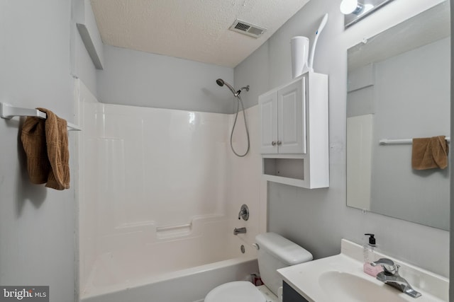 7140 Ladd Cir, Frederick, MD 21703 - bathroom featuring toilet, a textured ceiling,  shower combination, and vanity