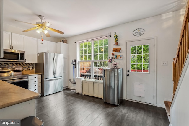 7140 Ladd Cir, Frederick, MD 21703 - kitchen with appliances with stainless steel finishes, ceiling fan, white cabinetry, backsplash, and dark wood-style floors