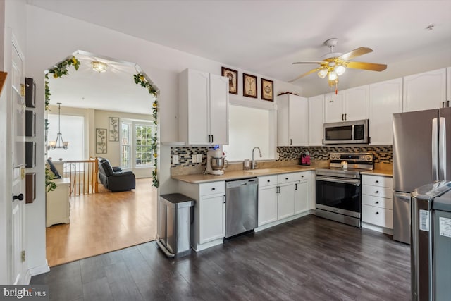 7140 Ladd Cir, Frederick, MD 21703 - kitchen featuring appliances with stainless steel finishes, ceiling fan, light countertops, and dark wood finished floors