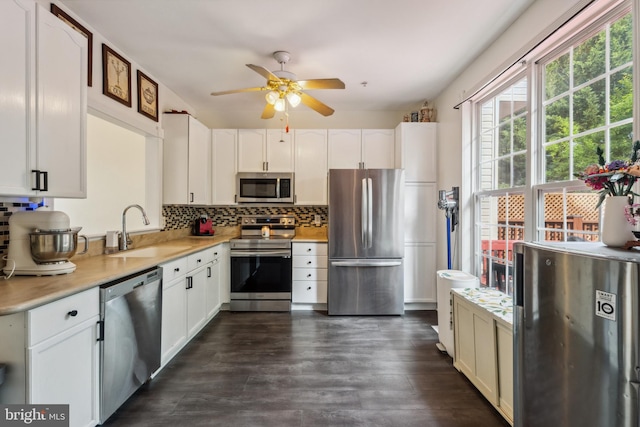 7140 Ladd Cir, Frederick, MD 21703 - kitchen with stainless steel appliances, a sink, a ceiling fan, decorative backsplash, and light countertops