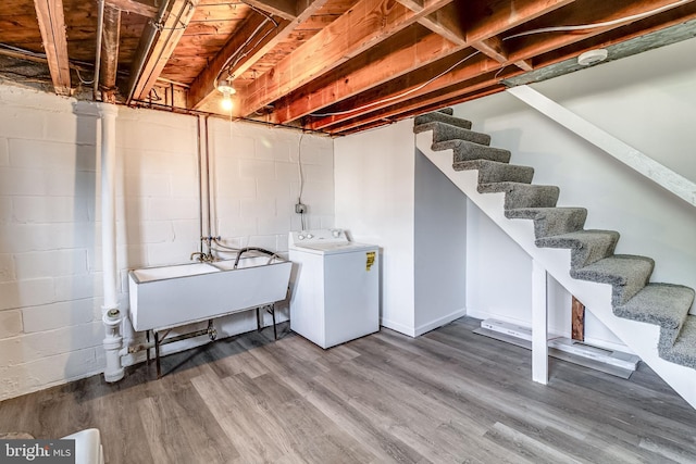 151 Bennett Rd, Essex, MD 21221 - unfinished basement with washer / clothes dryer, a sink, wood finished floors, stairs, and concrete block wall