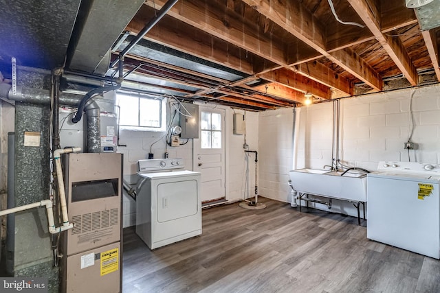 151 Bennett Rd, Essex, MD 21221 - basement with a sink, separate washer and dryer, electric panel, and wood finished floors