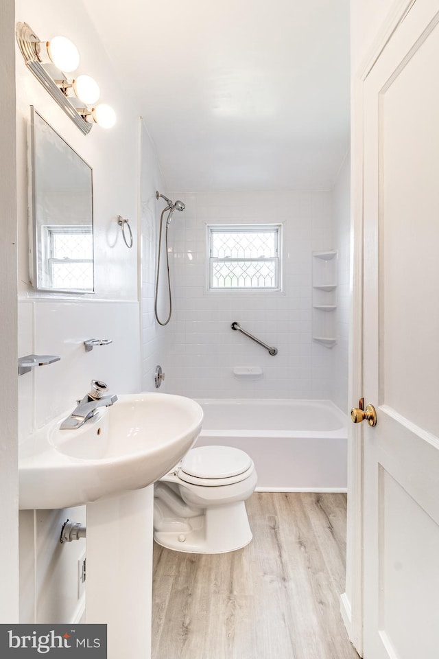 151 Bennett Rd, Essex, MD 21221 - bathroom with wood finished floors, bathtub / shower combination, and toilet