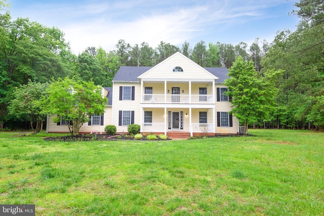 81 Rivers End Dr, Seaford, DE 19973 - greek revival inspired property with covered porch, a balcony, a front lawn, and cooling unit