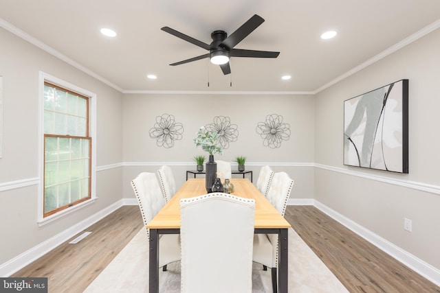 81 Rivers End Dr, Seaford, DE 19973 - dining room with wood finished floors, recessed lighting, ceiling fan, baseboards, and crown molding