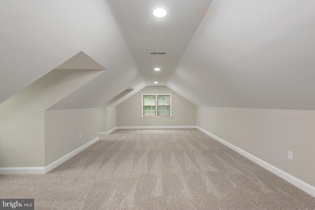 81 Rivers End Dr, Seaford, DE 19973 - additional living space with baseboards, lofted ceiling, light carpet, and recessed lighting