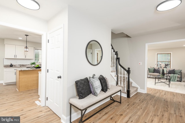 81 Rivers End Dr, Seaford, DE 19973 - corridor featuring light wood-style flooring, stairs, and baseboards