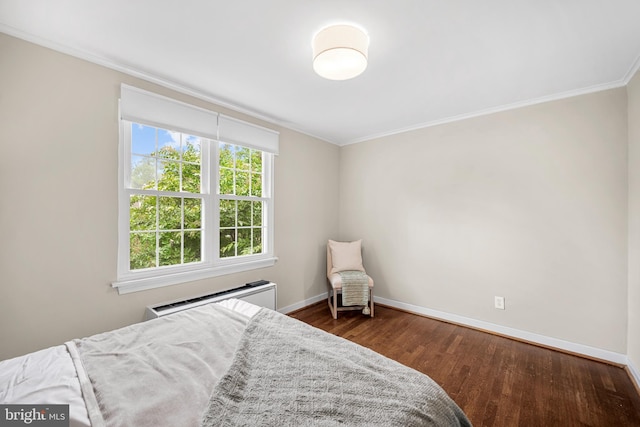 117 E Glebe Rd Unit C, Alexandria, VA 22305 - bedroom with ornamental molding, baseboards, dark wood-type flooring, and a wall mounted air conditioner
