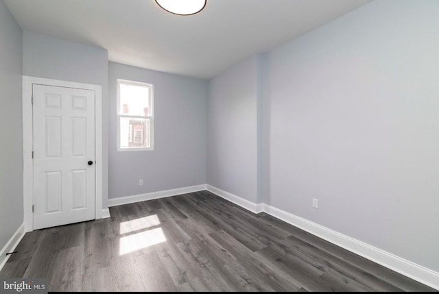 4605 N 13th St, Philadelphia, PA 19140 - spare room featuring dark wood-style floors and baseboards