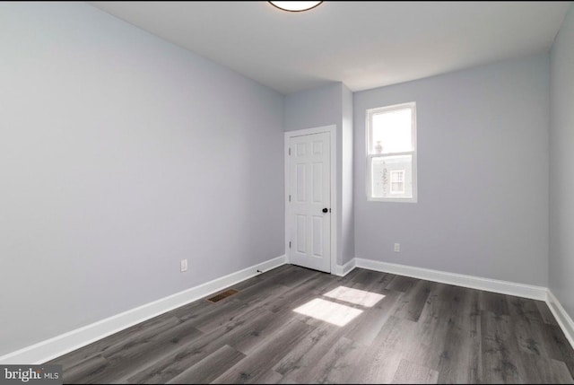 4605 N 13th St, Philadelphia, PA 19140 - unfurnished room with baseboards and dark wood-style floors