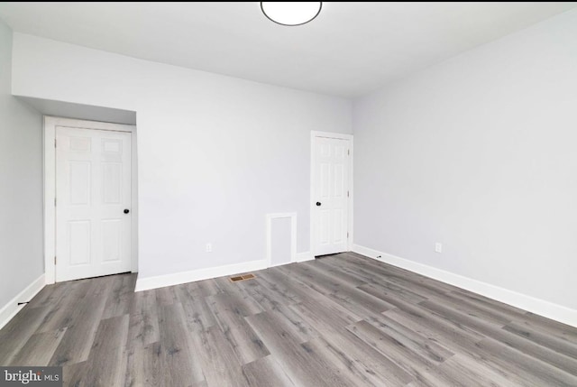 4605 N 13th St, Philadelphia, PA 19140 - unfurnished bedroom with wood finished floors and baseboards