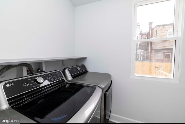 4605 N 13th St, Philadelphia, PA 19140 - laundry room with washer and clothes dryer and baseboards