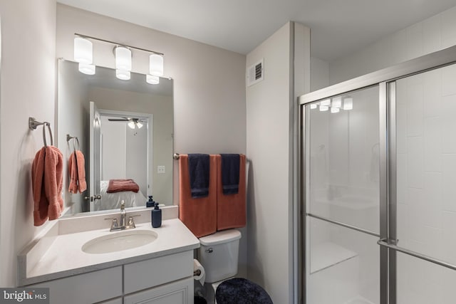 9909 Kildore Way, Fort Washington, MD 20744 - bathroom with vanity, a shower stall, toilet, and ceiling fan