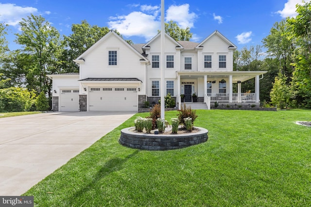 9909 Kildore Way, Fort Washington, MD 20744 - view of front of property featuring a porch, driveway, a front yard, and an attached garage