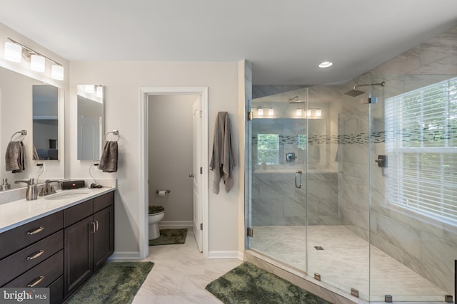 9909 Kildore Way, Fort Washington, MD 20744 - bathroom featuring vanity, marble finish floors, toilet, baseboards, and a stall shower