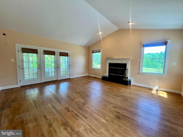 614 Wolfe Reserve Way, Harwood, MD 20776 - unfurnished living room with lofted ceiling, wood finished floors, baseboards, and french doors