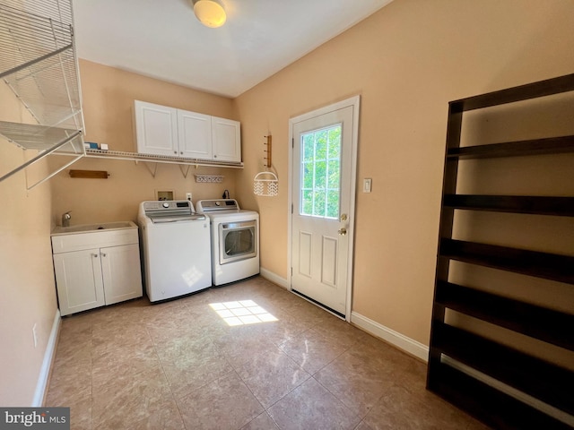 614 Wolfe Reserve Way, Harwood, MD 20776 - laundry room featuring cabinet space, independent washer and dryer, baseboards, and light tile patterned floors