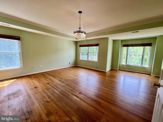 614 Wolfe Reserve Way, Harwood, MD 20776 - empty room with a chandelier, baseboards, wood finished floors, and crown molding