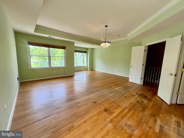 614 Wolfe Reserve Way, Harwood, MD 20776 - unfurnished room featuring a chandelier, light wood-style floors, ornamental molding, and baseboards