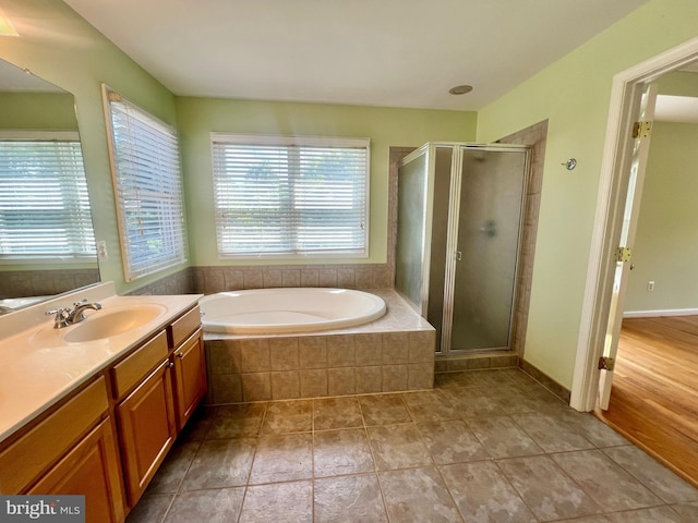 614 Wolfe Reserve Way, Harwood, MD 20776 - bathroom with vanity, a bath, and a shower stall
