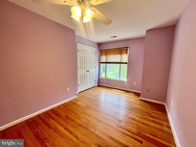614 Wolfe Reserve Way, Harwood, MD 20776 - unfurnished bedroom featuring baseboards, light wood-style floors, a ceiling fan, and a closet