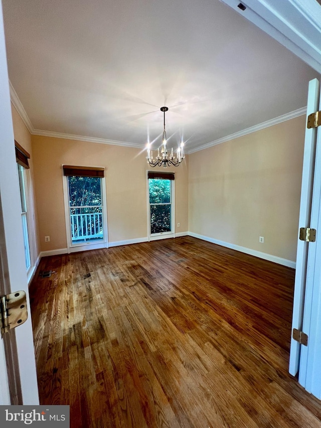 614 Wolfe Reserve Way, Harwood, MD 20776 - empty room with a chandelier, wood finished floors, crown molding, and baseboards