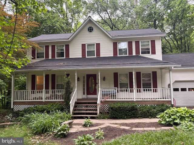 2750 Karen Dr, Chesapeake Beach, MD 20732 - view of front of property with covered porch, an attached garage, and roof with shingles