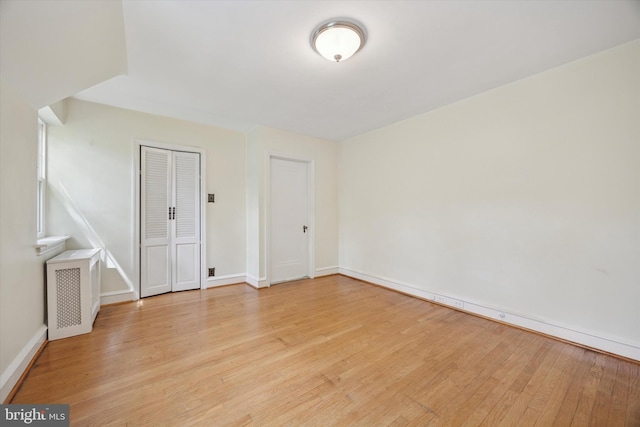 1100 Drexel Ave, Drexel Hill, PA 19026 - spare room featuring radiator, light wood-type flooring, and baseboards