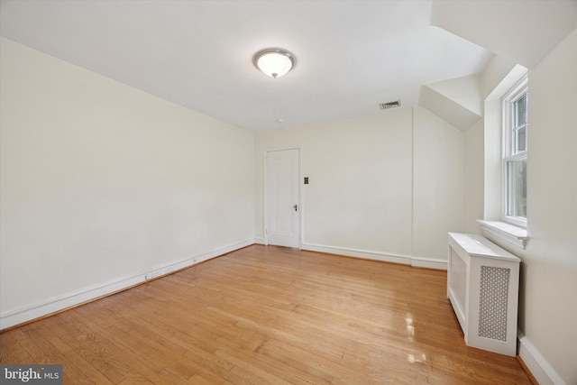 1100 Drexel Ave, Drexel Hill, PA 19026 - unfurnished room featuring light wood-style flooring, radiator, and baseboards