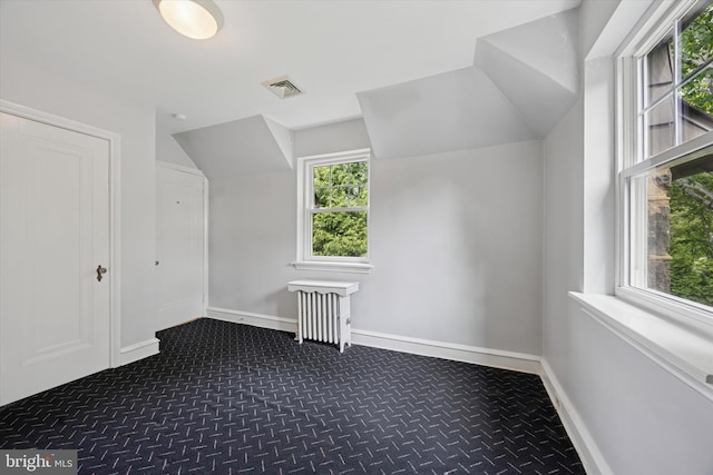 1100 Drexel Ave, Drexel Hill, PA 19026 - bonus room featuring radiator heating unit, dark colored carpet, vaulted ceiling, and baseboards
