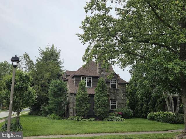1100 Drexel Ave, Drexel Hill, PA 19026 - view of side of home with stone siding, a yard, and roof with shingles