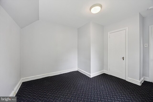 1100 Drexel Ave, Drexel Hill, PA 19026 - additional living space featuring dark carpet, baseboards, and vaulted ceiling