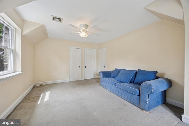 1100 Drexel Ave, Drexel Hill, PA 19026 - unfurnished living room featuring carpet, a ceiling fan, healthy amount of natural light, lofted ceiling, and baseboards