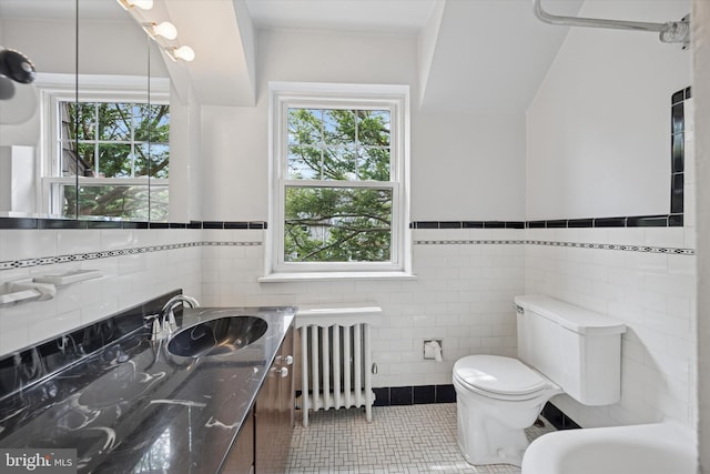 1100 Drexel Ave, Drexel Hill, PA 19026 - bathroom with radiator, tile walls, tile patterned flooring, toilet, and vanity