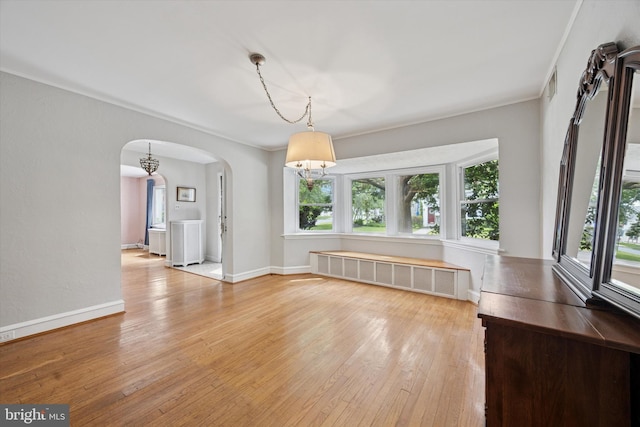 1100 Drexel Ave, Drexel Hill, PA 19026 - unfurnished room with radiator, arched walkways, hardwood / wood-style floors, baseboards, and ornamental molding