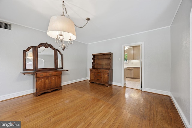 1100 Drexel Ave, Drexel Hill, PA 19026 - spare room with light wood-style floors, baseboards, a chandelier, and crown molding