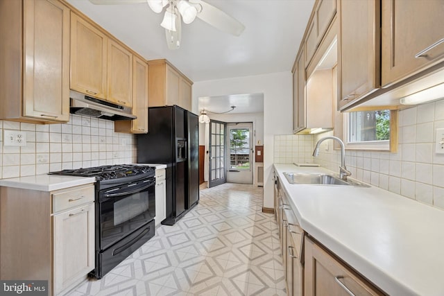 1100 Drexel Ave, Drexel Hill, PA 19026 - kitchen with black appliances, under cabinet range hood, a sink, a ceiling fan, and light countertops