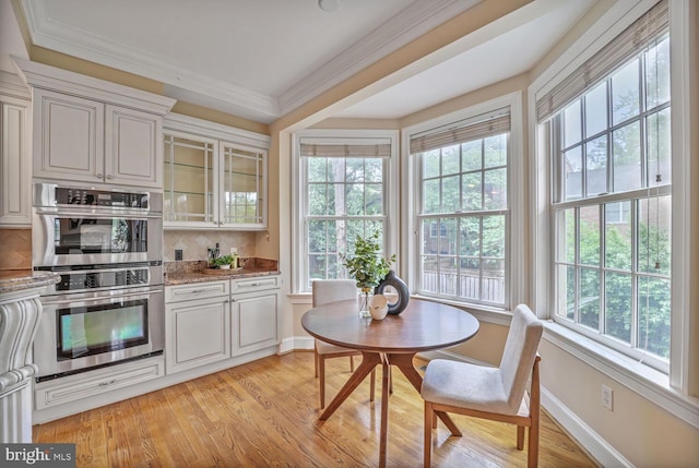 2053 Mayfair Mclean, Falls Church, VA 22043 - kitchen featuring stainless steel double oven, plenty of natural light, glass insert cabinets, ornamental molding, and backsplash