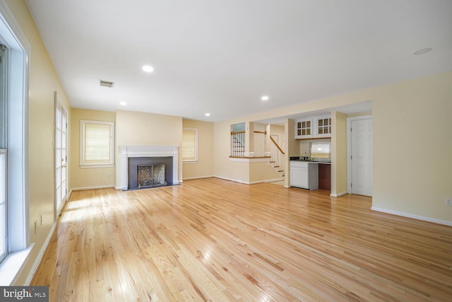 2053 Mayfair Mclean, Falls Church, VA 22043 - unfurnished living room featuring stairway, light wood-style floors, baseboards, and recessed lighting