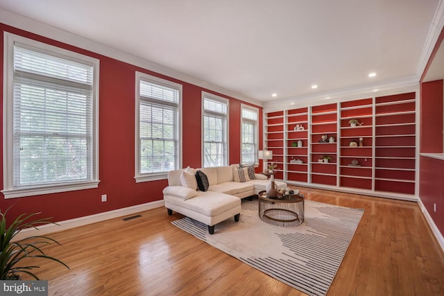 2053 Mayfair Mclean, Falls Church, VA 22043 - living area featuring crown molding, baseboards, wood finished floors, built in features, and recessed lighting