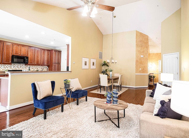1423 Overlook Way, Bel Air, MD 21014 - living area with high vaulted ceiling, wood finished floors, a ceiling fan, a chandelier, and baseboards
