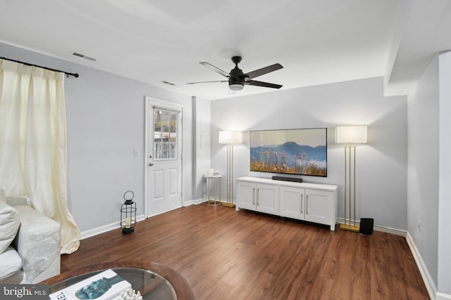 14617 Woodspring Ct, Centreville, VA 20120 - unfurnished living room featuring dark wood finished floors, baseboards, and a ceiling fan
