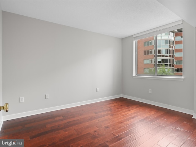 1045 N Utah St Unit 2-404, Arlington, VA 22201 - spare room with wood finished floors and baseboards