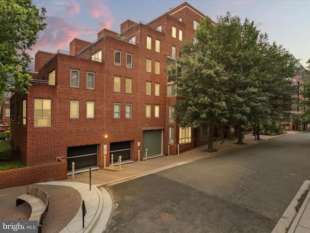 1045 N Utah St Unit 2-404, Arlington, VA 22201 - property at dusk featuring a garage