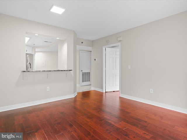 1045 N Utah St Unit 2-404, Arlington, VA 22201 - spare room featuring hardwood / wood-style flooring, baseboards, and recessed lighting