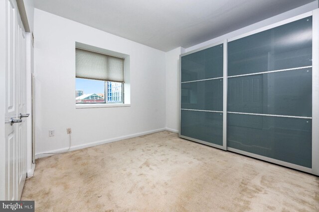 901 N Penn St Unit R305, Philadelphia, PA 19123 - unfurnished bedroom featuring carpet and baseboards