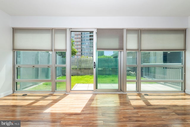 901 N Penn St Unit R305, Philadelphia, PA 19123 - doorway to outside with wood finished floors and baseboards