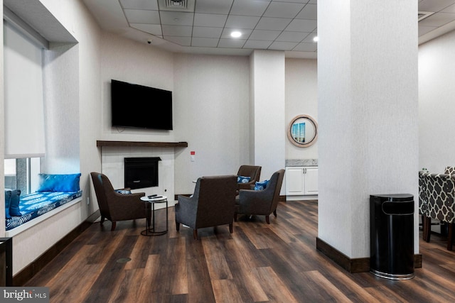 901 N Penn St Unit R305, Philadelphia, PA 19123 - living room with dark wood-type flooring, a drop ceiling, and a fireplace
