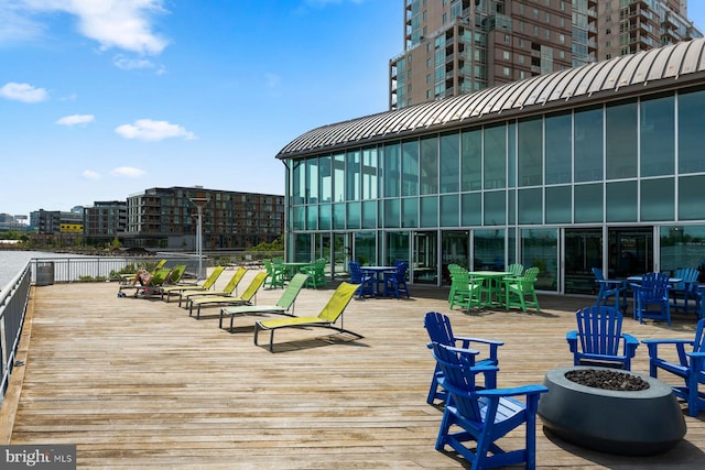 901 N Penn St Unit R305, Philadelphia, PA 19123 - wooden terrace with an outdoor fire pit and outdoor dining area